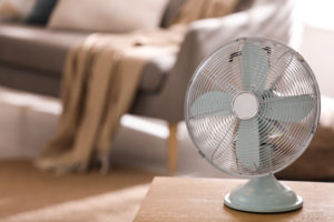 shutterstock 1932119525 Modern,Electric,Fan,On,Wooden,Table,In,Living,Room.,Space